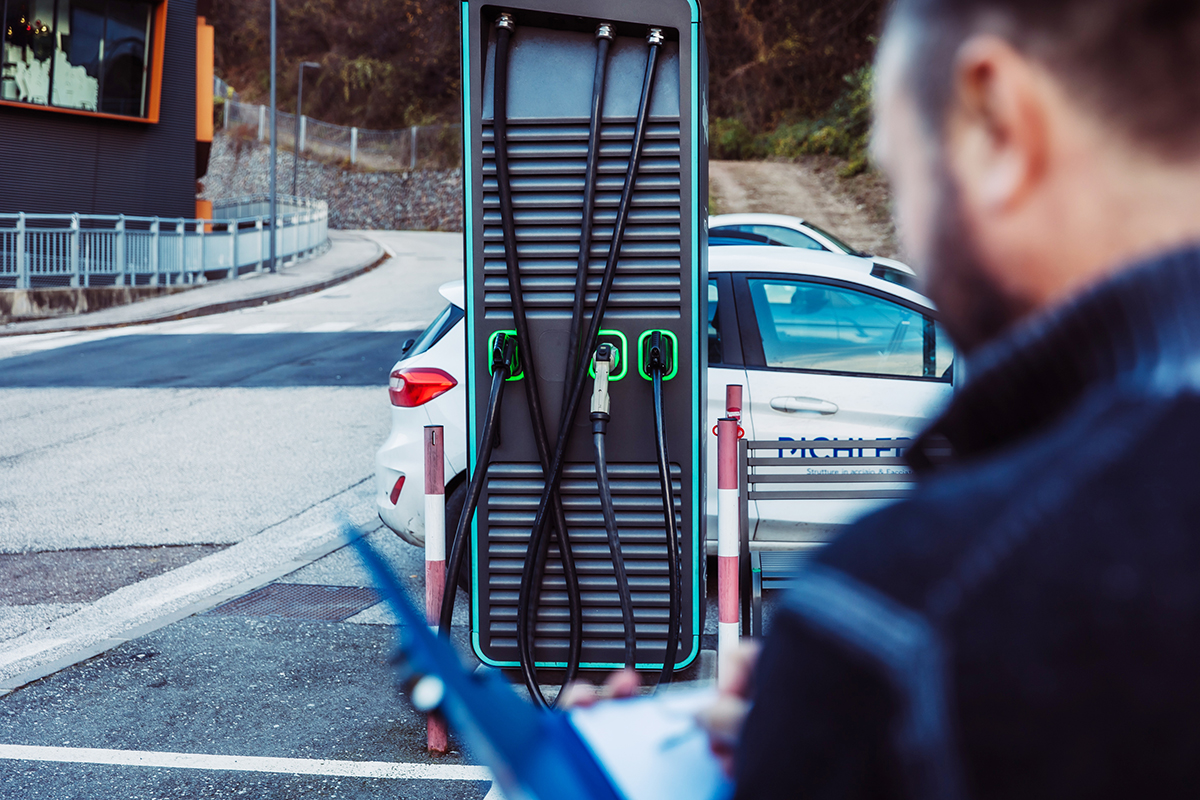 Independent L staff recording EV charging accessibility data, later published via the Open Data Hub Data Browser.