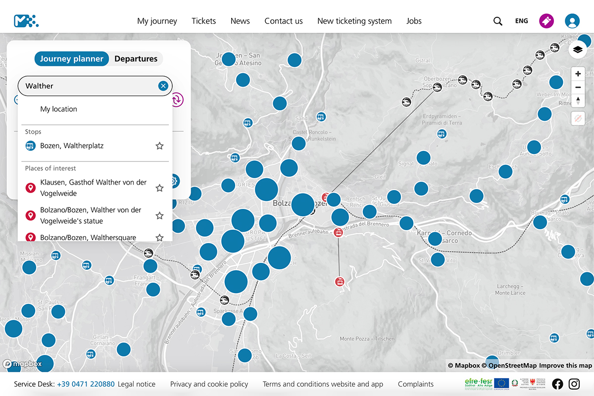 Individual using the Südtirolmobil app to access real-time mobility and transportation information.